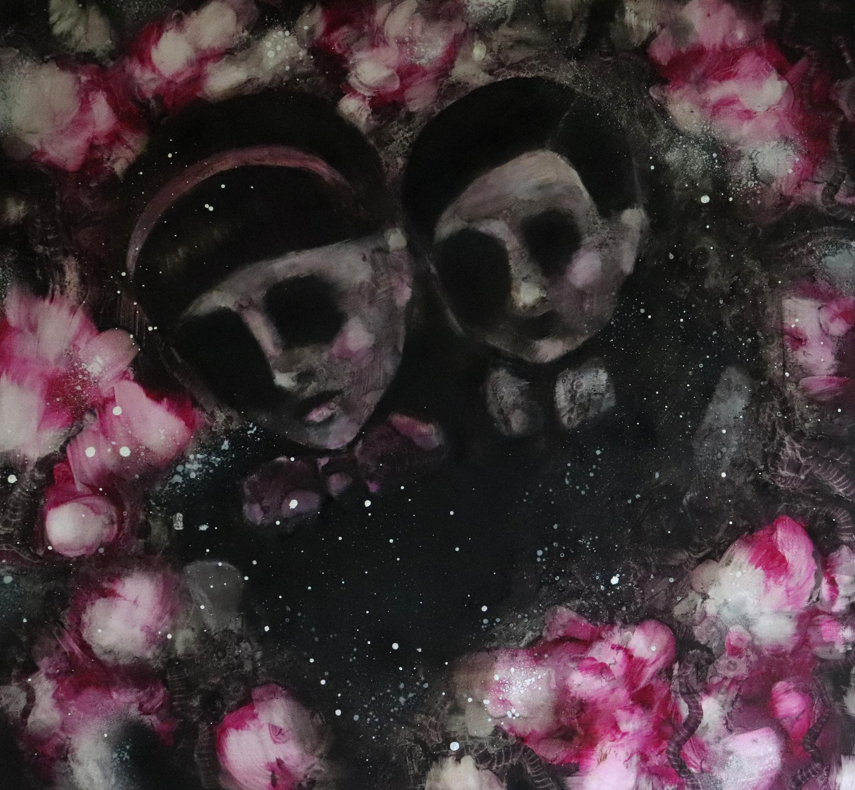 Two skull-like faces nestled together in a dense field of pink and white blossoms.