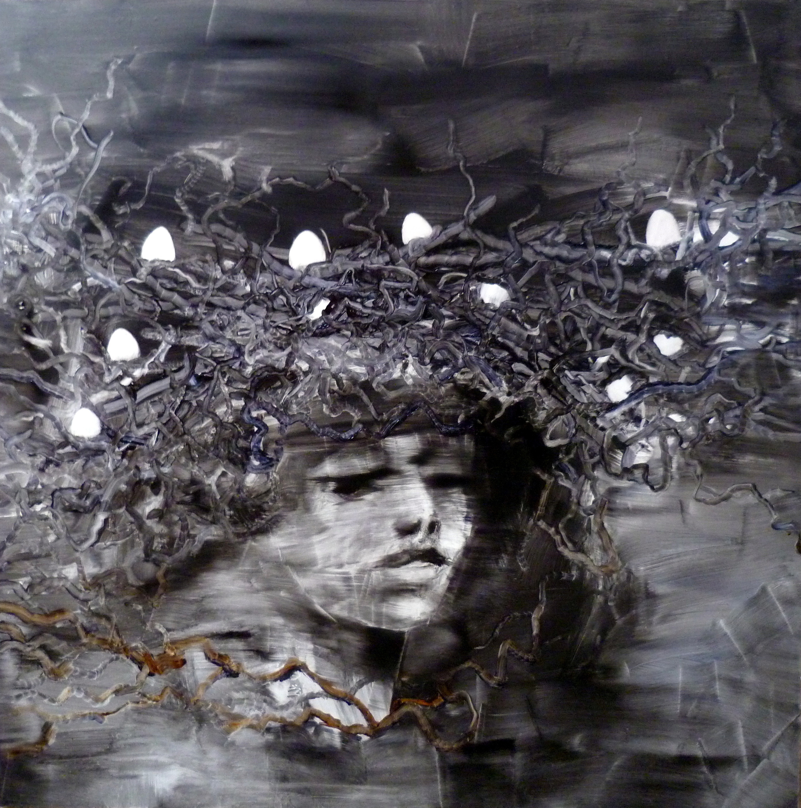 A grayscale face looking outward beneath a dense, nest-like crown dotted with white lights.